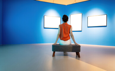 Woman sitting and looking blank pictures