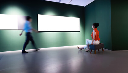 People walking in art exhibition