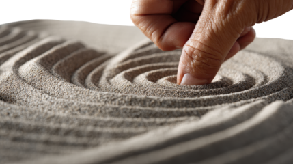 A hand creating patterns in sand, symbolizing mindfulness. transparent background