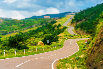 Picturesque mountain landscape with winding asphalt road. Caucasus