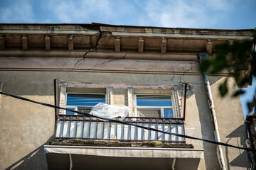 Crack running through building show earthquake damage, consequences of seismic activity. Aging...