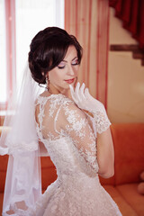 Fototapeta premium A woman in a wedding dress is posing for a picture