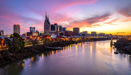 Naklejka premium Vibrant Urban Skyline Reflected in River at Sunset - Majestic Cityscape View