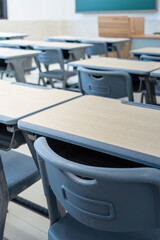 Tables and chairs in the school classroom