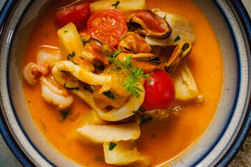 Vibrant seafood stew with fresh vegetables in a bowl