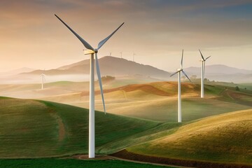 Serene landscape featuring wind turbines on rolling hills at sunrise, showcasing renewable energy