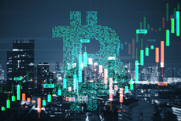 Obraz na płótnie Canvas Bitcoin symbol with financial market candlestick chart over city skyline at night showing cryptocurrency investment and trading concept.