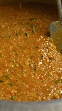 Bisi Bele Bath being Cooked and Prepared in a Big Pot - A traditional Karnataka Rice Dish