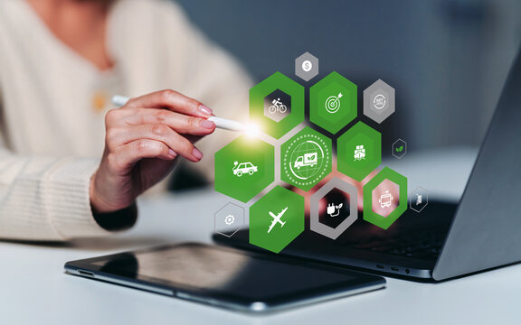 Businesswoman pointing technology for green logistics invent the clean energy process to Net zero carbon emission, sustainable strategy for global shipment or cargo shipping