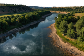 Aerial view of a winding river surrounded by lush green vegetation and hills