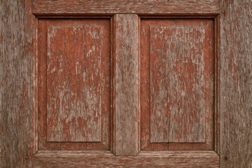 Aged weathered wooden surface with a vibrant red door texture and rustic wood background
