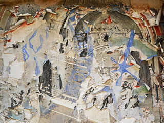 Poster remains on a wall