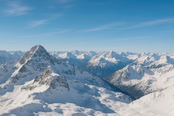 Majestic snow-capped peaks under a clear blue sky in a high-altitude region
