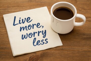 Inspirational handwritten quote on a napkin paired with a coffee cup