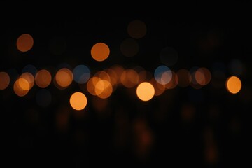 Nighttime celebration with blurred luminous decorations against a dark backdrop