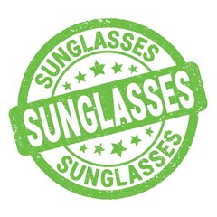 SUNGLASSES text written on green round stamp sign.