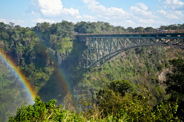 Iron bridge with rainbow at Victoria Falls