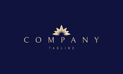 A vector golden logo featuring an abstract image a sun with radiant rays shining behind stylized leaves.