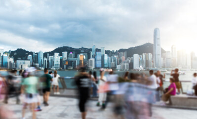 Blurred image of people walking on the Hong Kong waterfront