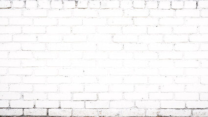 Obraz premium A white-painted brick wall with visible mortar lines, creating a clean and minimalist texture.