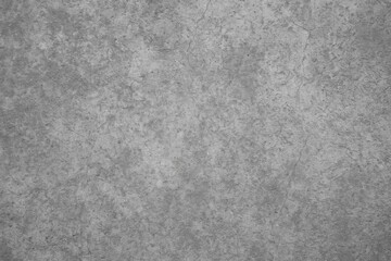 Texture of rough cement on a gray backdrop with aged concrete surface