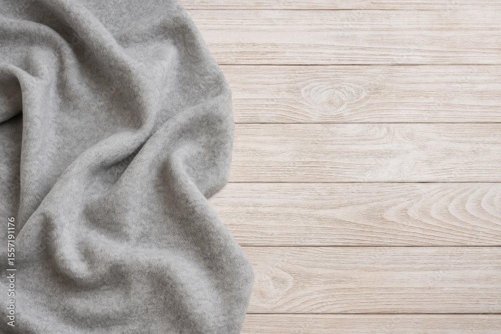 Poster gray wool fabric displayed on a rustic wooden surface