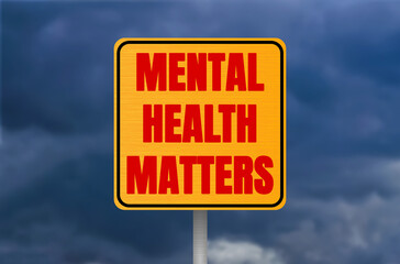Mental health matters message written on metal sign on cloudy sky background. Conceptual mental...
