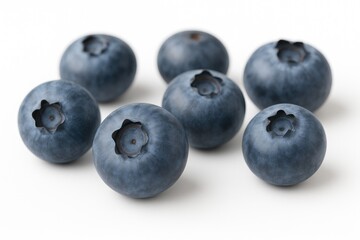 Detailed close-up of fresh blueberry fruit against a plain white backdrop for creative projects