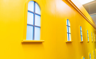 Yellow wall with many windows