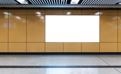 Blank billboard on wall of subway station
