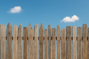 Obraz premium Rustic wooden fencing under a clear blue sky, ideal for your creative ideas or projects.