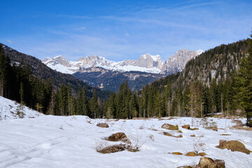 March 2025: Scenic view of snow covered mountains against sky, Fassa Valley.