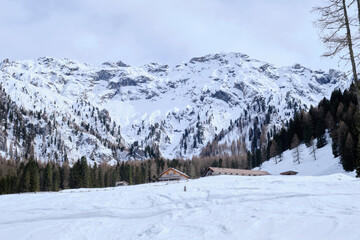 March 2025: Scenic view of snow covered mountains against sky, Fassa Valley.