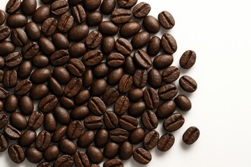 Fototapeta premium Close-up of dark roasted coffee beans on a white surface