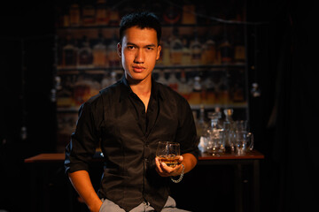 Closeup businessmen holding a glass of whiskey