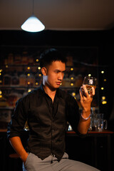 Closeup businessmen holding a glass of whiskey