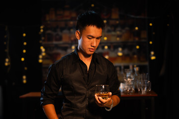 Closeup businessmen holding a glass of whiskey