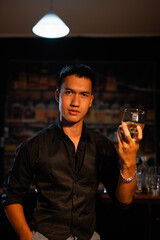 Closeup businessmen holding a glass of whiskey