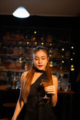  Closeup business woman holding a glass of wine