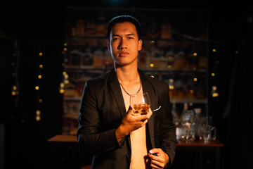 Closeup businessmen holding a glass of whiskey