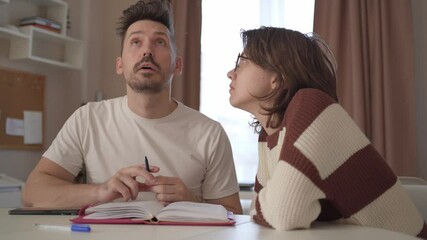 A young couple discusses home renovation and shares household tasks, capturing authentic moments of teamwork and love. Perfect for lifestyle, relationship, and DIY content