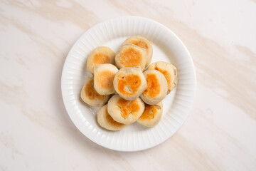 Bakpia is a flat round cookie, made from a mixture of green beans and sugar, then wrapped in flour dough and baked. This cookie is popular as a typical Yogyakarta souvenir.