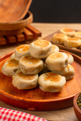 Bakpia is a flat round cookie, made from a mixture of green beans and sugar, then wrapped in flour dough and baked. This cookie is popular as a typical Yogyakarta souvenir.