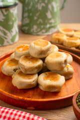 Bakpia is a flat round cookie, made from a mixture of green beans and sugar, then wrapped in flour dough and baked. This cookie is popular as a typical Yogyakarta souvenir.
