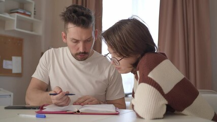 A young couple discusses home renovation and shares household tasks, capturing authentic moments of teamwork and love. Perfect for lifestyle, relationship, and DIY content