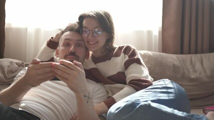 A young couple discusses home renovation and shares household tasks, capturing authentic moments of teamwork and love. Perfect for lifestyle, relationship, and DIY content