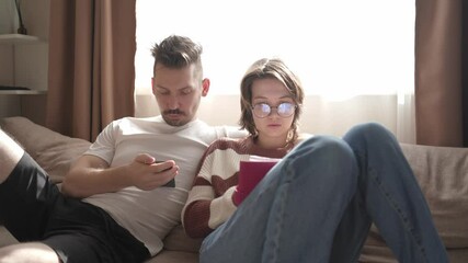 A young couple discusses home renovation and shares household tasks, capturing authentic moments of teamwork and love. Perfect for lifestyle, relationship, and DIY content - Powered by Adobe