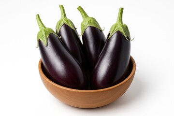 Bowl of eggplant fruits on a plain white backdrop