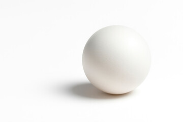 A white ball on a white background. Space for text.