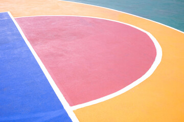 Outdoor basketball court background with colorful pattern and white outline on concrete floor surface, High angle view with copy space